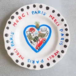 Assiette plate en faïence Merci