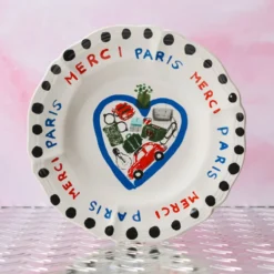 Assiette plate en faïence Merci