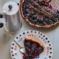 Assiette plate en faïence Merci